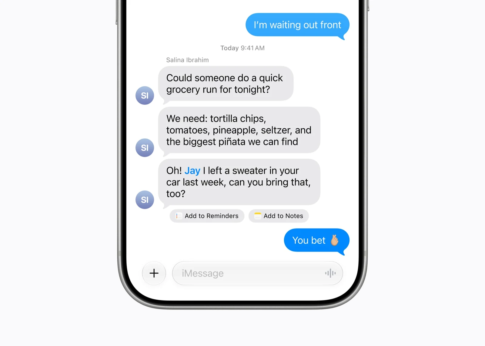 iPhone se skupinovou konverzací ve Zprávách, kde pod anglickou zprávou o nákupu a zapomenutém svetru nabízí tlačítka Přidat do Připomínek a Přidat do Poznámek